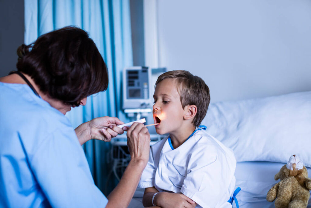 classic female-doctor-examining-patient-mouth-2021-08-28-16-44-42-utc